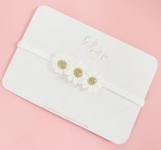 One size soft nylon dainty headband. Small daisies so not overpowering and smallest babies. Follow us on Instagram for fiver Friday deals and new items.  https://www.instagram.com/bellebowtiquehandmade/ Find us on Facebook  Http://www.facebook.com/Bellebowtique-100830351267922/ SAFETY Please use all headbands and clips with adult supervision. DO NOT leave your child unattended while wearing any headband or clip as some may contain small parts which maybe pulled of and cause chocking. Do not let your child nap wearing hair accessories. You assume any and full responsibility for the safety of your child. "Belle Bowtique" offers handmade accessories such as headbands, pigtail bows, christening headbands, lace headbands, boho hair clips, baby girl headbands, birthday headbands, adult headbands Adjustable White Flower Hair Accessories, Adjustable White Headband For Summer, Adjustable White Summer Headband, Handmade White Headband Hair Accessory, Cute White Headband For Birthday, Cute White Birthday Headband, White Handmade Headband, Adjustable Flower Headband Gift, Floral Adjustable Headband Gift