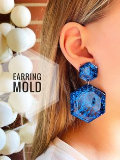 the earring mold is designed to look like hexagons with blue glitter on them