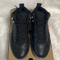 Air Jordan 12 Retro Black/Black - Crimson Black Leather Lace-up Jordan Shoes, Black Leather Basketball Shoes With Laces, Custom Leather Sneakers With Air Max Cushioning, Leather High-top Jordan Shoes With Air Max Cushioning, Black High-top Sneakers With Air Cushioning For Sports, Black Low-top Jordan Shoes With Laces, Black Low-top Jordan Shoes, Black Jordan Shoes With Air Cushioning For Streetwear, Black Leather Lace-up Basketball Shoes