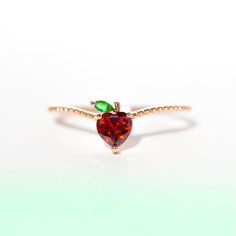 From the best-selling Girls Crew Fruit Basket Collection comes our Apple Ring. This ring has a curved band to make sure our vibrant apple sits perfectly on your finger! 18k gold plated, 18k rose gold plated, or rhodium plated over a brass base Colored cubic zirconia stones Available in sizes 5-9 Approx 7mm width Shop o Strawberry Ring, Apple Rings, Charm Ring, Cute Strawberry, Flower Girl Gifts, Necklace Chain Lengths, January Birthstone, Engraved Gifts, Charm Rings