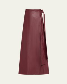 Toccin "Beatrice" midi skirt in vegan leather    High rise    Side seam pockets    Wrap silhouette    Hem falls below the knee    Side tie closure     Polyester    Imported Leather Wrap Skirt, Leather Wraps, Bergdorf Goodman, Wrap Skirt, The Knee, Vegan Leather, Midi Skirt, Tops Designs, High Rise