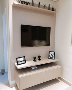 a flat screen tv mounted to the side of a wall