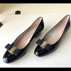 Salvatore Ferragamo Black Vara Bow Pumps Featuring An Almond Toe, A Bow Detail, A Slip-On Style, A Low Block Heel And Gold-Tone Hardware. These Are In Great Condition And A Staple For Every Closet! Size 7! Retail: $650 Calf Leather Flat Heel Heels For Formal, Calf Leather Heels With Flat Heel For Formal Occasions, Formal Flat Heel Calf Leather Heels, Formal Calf Leather Flat Heels, Elegant Workwear Heels With Rubber Sole, Elegant Closed Toe Heels With Rubber Sole, Elegant Heels With Rubber Sole For Evening, Classic Formal Heels With Medium Fit, Elegant Heels With Rubber Sole For Business