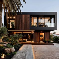 a modern house with wood siding and glass windows