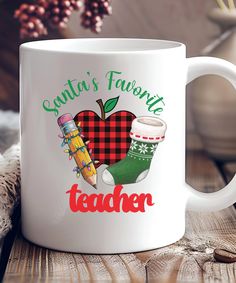 a white coffee mug with santa's favorite teacher written on the front and back