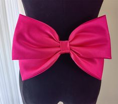 Friends, welcome to my store. Our wedding bows can be customized according to your needs, you can provide the size and different styles and fabrics, we will make your favorite wedding bow based on the information you provide. The removable wedding bow is made of high-grade soft satin. The butterfly is equipped with fixing pins and can be easily fixed in different places. Usually, for customized colors and different sizes of bows, the package will take at least about 20 days to arrive. Elegant Fitted Pink Sashes, Party Bow Tie With Ribbon, Pink Satin Wedding Bow, Satin Bow With Bow Tie Back For Party, Satin Bow With Tie Back For Party, Pink Formal Bow With Bow Tie Back, Satin Bow Tie With Ribbon For Party, Red Satin Bow For Party, Pink Elegant Sash For Formal Occasions