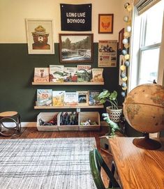 a living room filled with furniture and pictures on the wall next to a rug covered floor