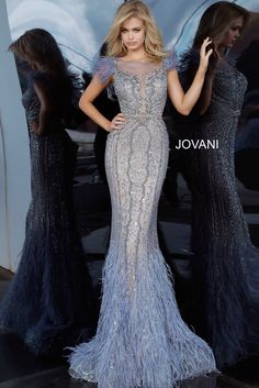 Command attention in this embellished feather long sleeveless dress with a fitted skirt by Jovani 02326. This exquisite dress features a floor-length, fit and flare silhouette that hugs your curves beautifully before cascading into delicate feather embellishments at the hem. The intricate beaded detailing adds a touch of glamour, ensuring you shine brightly on any special occasion. Made from sheer fabric, this sleeveless gown provides an elegant and dreamy look with its bateau neckline. The clos 18th Bday, Intricate Beading, Mermaid Evening Gown, Jovani Dresses, Sleeveless Gown, Embellished Gown, Mermaid Style, Sleeveless Long Dress, Illusion Neckline