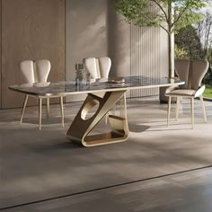 a modern dining table with chairs around it