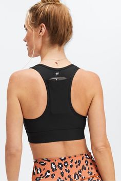 On-The-Go Medium Impact Sports Bra Fabletics black female Activewear >> Womens >> Sports Bras >> Sports Bra >> Medium Impact regular Training 4-Way Stretch/Pockets/Removable Bra Cups Our fan-favorite pocket bra SHOP ALL On-The-Go Sporty Activewear With Pockets For Sports, Athleisure Activewear With Pockets For Sports, Functional Sports Activewear With Pockets, Sporty Activewear With Side Pockets, Fitted Activewear With Side Pockets For Sports, Sporty Activewear With Pockets For Sports Events, Black Sportswear Activewear With Side Pockets, Sports Activewear With Pockets, Sporty Activewear For Running With Side Pockets