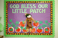 a bulletin board with an image of a scarecrow and pumpkins in the background