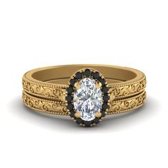 an antique style wedding ring set with a oval center stone