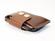 "Leather credit card wallet! Very comfortable & easy to wear. Color:brown. Size: 8 x 12 cm. It has 3 interior sleeves holds Nearly 12 cards , also Suitable for holding some cash. And it also can be used as a business card holder . This wallet created from hight quality \"Crazy horse leather\"! Crazy horse leathers are made by applying a special kind of wax to a full grain leather surface that has been buffed and smoothed out. The type of wax used rests independently upon the leather fibers a Brown Wallets With Card Slots For Everyday Use, Everyday Brown Wallets With Card Slots, Leather Brown Card Holder, Brown Pouch With Cell Phone Pocket As Gift, Brown Pouch With Cell Phone Pocket For Everyday Carry, Brown Rectangular Coin Purse With Card Slots, Brown Rectangular Coin Purse With Interior Card Slots, Gift Brown Pouch With Cell Phone Pocket, Brown Coin Purse With Interior Card Slots As Gift