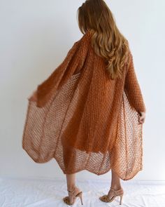 Hello, I'm the one, who won't let you down - burnt orange mohair cardigan. I will comfort you, keep you warm and will make you smile. I'm 100% hand made and proud of that. I consist of 70% italian kid mohair and 30% of nylon, which makes me incredibly natural. I'm quite unique as could be worn all year long. I'm embroidered with thin yarn of gold lurex, which makes me really chic. I'm in one size and one size fits all because my measurements are : ❤️ Width -54 cm ❤️ Lengths -125 cm If you would Long Kimono Cardigan, Orange Knit, Light Cardigan, Over Dress, Loose Knit Sweaters, Mohair Cardigan, Stylish Sweaters, Long Kimono, Cardigan Long