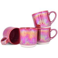 three pink coffee mugs sitting next to each other