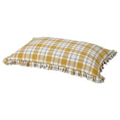 a yellow and white plaid pillow with ruffles on the bottom, sitting on a white background