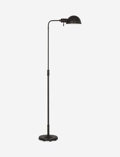 a black floor lamp on a white background with the light turned on and one arm down