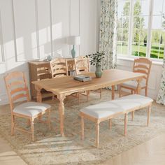 a dining table with six chairs and a bench in front of a window on a rug