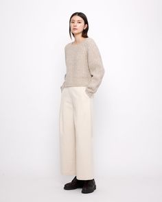 A chunky supersoft and ultra-warm yak-alpaca-extrafine merino wool knit. Features a relaxed and boxy fit, with a cropped silhouette. This sweater perfectly balances out all your high-waisted trousers. + Details Color: Light Taupe 31% Yak, 31% Alpaca, 22% Recycled Nylon, 16% RWS Extrafine Merino Wool XS, S, M, L Julie is 5’9” and wearing a S + Care Hand wash cold, lay flat to dry. Do not tumble dry. Can be dry cleaned. Please note, fine and soft wools can be susceptible to slight pilling. If pill Chunky Cropped Sweater, Sweater Shaver, Trousers Details, Knitwear Dress, Wool Knit, Soft Yarn, High Waisted Trousers, Cropped Sweater, Color Light