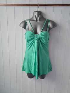 Strappy green vintage 90s y2k top with sequin detail, acemetric hem No labels but approx UK8/10 US 4/6 Unusual wearable top Good pre-loved condition  Measurements:(unstretched) 15" pit to pit  25" strap to hem side 20" length centre top to point at front Y2k Tops With Spaghetti Straps And Built-in Bra, Green Tops With Built-in Bra For Spring, Green V-neck Y2k Tops, Green Y2k Tank Top For Spring, Y2k Style Stretch Tops With Built-in Bra, Green Cotton Y2k Tank Top, Fitted Green Camisole For Summer, Green Y2k Style Summer Tank Top, Green Y2k Style Summer Top