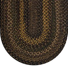 an oval rug with yellow and brown stripes on it's center piece, in the shape of a circle