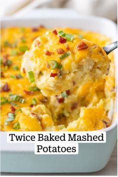 a spoonful of cheesy potato casserole with bacon and green onions