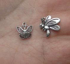 "This is a small sterling silver butterfly charm. This beautiful filigree butterfly measures 10x10.5mm, with a 1mm ID closed ring or 3/8\" at the top of the side and 7/16\" from top to bottom counting the ring at the top. Price is for two butterfly charms at $6.50. Price is for three butterfly charms at $9.40. Please convo me if you would like more. Shown alone in the 5th photo. This is a sterling silver bee charm. Price is for one at $6.55 Measurement/Size (mm):Sterling Silver One Sided 14mm x Tiny Sterling Silver Butterfly Jewelry, Tiny Butterfly Sterling Silver Jewelry, Silver Butterfly Charm Jewelry, Silver Metal Jewelry With Butterfly Charm, Tiny Silver Charms For Gifts, Silver Butterfly Jewelry For Jewelry Making, Small-sized Silver Charms For Gifts, Silver Butterfly Charms Jewelry, Nickel-free Silver Butterfly Jewelry