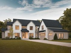 this is an artist's rendering of the modern farmhouse style house plans that include two story homes and three car garages