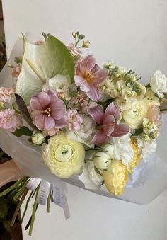 a bouquet of white and pink flowers on display