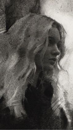 a black and white photo of a woman with long hair looking at her reflection in the mirror