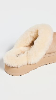 Find UGG Disquette Slippers on Editorialist. Cannot be shipped outside the USA Dyed shearling, from Australia. Upper: Cowhide suede. Lining: Shearling. Shearling trim and footbed. Round toe. EVA sole. Imported, Vietnam. This item cannot be gift-boxed. Measurements: Platform: 1.5in / 35mm Uggs Slippers, Cute Converse Shoes, Cute Converse, Thanksgiving 2024, Soft Gloves, Hoka Shoes, Shoe Wishlist, Please And Thank You, Ugg Slippers