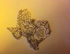 a drawing of some flowers on a wall