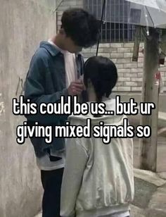 two people standing next to each other with an umbrella over their heads and the text, this could be us but ur giving mixed signals so