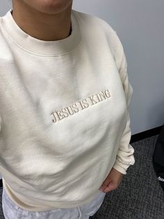 God is Good & Jesus is King Crewneck sweatshirts! Super adorable Faith Based Crewnecks! Choose one or both! You can customize the sweatshirt color and thread colors!  **THIS LISTING IS FOR ONE SWEATSHIRT** Hoodies and Sweatshirts are MIDWEIGHT and are super soft on the inside! The God is Good sweatshirt pictured is ROSE with WHITE Thread The Jesus is King sweatshirt pictured is CREAM with KHAKI Thread These are embroidered on my commercial embroidery machine. I will use the best brand sweatshirt Cream Crew Neck Sweatshirt With Letter Embroidery, White Fleece Sweatshirt With Embroidered Text, Cream Sweatshirt With Embroidered Logo Relaxed Fit, Cream Long Sleeve Sweatshirt With Embroidered Text, Cream Long Sleeve Sweatshirt With Letter Print, Cream Long Sleeve Sweater With Letter Embroidery, Cream Long Sleeve Letter Print Sweatshirt, Cream Embroidered Crew Neck Sweatshirt, Cream Sweatshirt With Embroidered Text For Fall