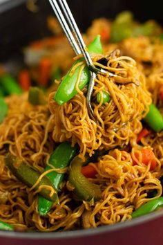 a bowl filled with noodles and vegetables