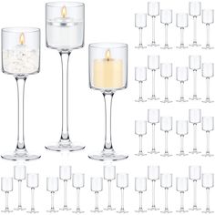 many wine glasses with candles in them