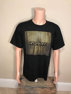 Shirt looks like new inside and out. Adult size large. Raised gold letters. Hollywood California. Just a cool old shirt. Check out pictures to see what you get. Raised Letters, Retro Logos, Old Shirts, Retro Photo, Gold Lettering, Hollywood California, Blue Tee, Gold Letters, Vintage Hollywood