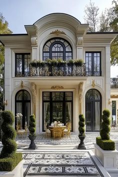 Luxury home facade with grand arches and lush topiaries. Peek into the extravagant realm of luxury homes with insights on posh designs, exclusive features, and a sprinkle of real estate magic. American Small House, Mod Board, Home Facade, Mini Mansion, Classic Mansion, Classic Facade, French Window, Luxury Architecture