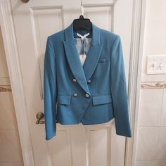 Veronica Beard Hydrangea Blue Gail Dickey Blazer Size Us 2 Womens New Never Worn Please Note Faint Pinsize Hole From Censor In Back By Seam As Shown. Not Noticeable From Afar Color: Hydrangea Veronica Beard "Miller" Dickey Jacket With Silver-Tone Buttons Peak Lapels Double-Breasted Front Long Sleeves With Button Cuffs Flap And Welt Pockets Vented Back Tailored Fit Nylon/Polyamide/Elastane Lining: Polyester Dry Clean Approximate Measurements (Inch) Length 22 Sleeve 24.5 Pit To Pit 18.5 Waist 15.5 Spring Blue Blazer With Double Button Closure, Blue Double Button Blazer For Spring, Chic Blue Blazer With Double Button Closure, Chic Tailored Light Blue Blazer, Chic Fitted Light Blue Blazer, Chic Light Blue Fitted Blazer, Chic Light Blue Blazer For Formal Occasions, Chic Light Blue Blazer For Work, Fitted Light Blue Outerwear With Button Closure