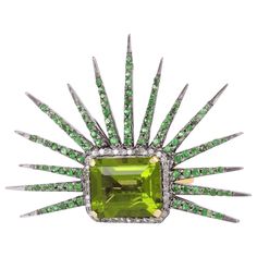 This stunning statement ring has been meticulously crafted from 18-karat gold & sterling silver. It is centered with a striking 6.3 carats Peridot, 1.18 Tsavorite and illuminated with .16 carats glimmering diamonds. The ring is a size 7 and may be resized to larger or smaller upon request. FOLLOW MEGHNA JEWELS storefront to view the latest collection & exclusive pieces. Meghna Jewels is proudly rated as a Top Seller on 1stDibs with 5 star customer reviews. All items manufactured by us are handma Victorian Wedding Ring, Vintage Diamond Earrings, Victorian Diamond Ring, Sunburst Ring, Rosecut Diamond Ring, Diamond Cocktail Ring, Victorian Vintage, Diamond Bangles Bracelet, Vintage Diamond Rings