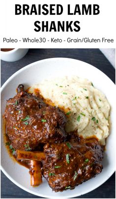 a white plate topped with meat and mashed potatoes