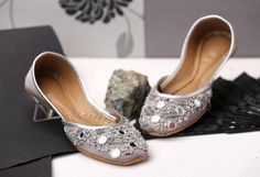 Exquisite Sindhi Khussa for bridal wear, perfectly elegant and designed to make your special day even more memorable. Featuring a sophisticated dove grey base with a subtle dull shine, these flat shoes are adorned with intricate mirror work and silver embellishments, creating a stunning blend of tradition and elegance. Product Details: Base Material: Elegant dove grey with a subtle dull shine Embellishments: Intricate mirror work and silver accents Design: Traditional Sindhi Karahi inspiration f Bollywood Style Wedding Shoes For Festive Occasion, Festive Formal Wedding Shoes With Gota Work, Elegant Handwork Wedding Shoes For Formal Occasions, Elegant Wedding Shoes With Handwork For Festive Occasion, Traditional Embellished Wedding Shoes For Formal Occasions, Elegant Formal Wedding Shoes With Handwork, Elegant Handwork Closed Toe Wedding Shoes, Elegant Closed Toe Wedding Shoes With Handwork, Elegant Cutdana Wedding Shoes For Reception