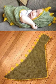 a baby laying on top of a couch next to a crocheted dinosaur blanket