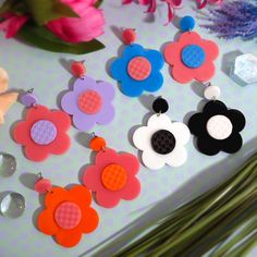 Bring back the totally groovy styles of the 60's and 70's to your retro outfits when you wear these mismatched Daisy Stud Earrings! 💙 Each Mod Fashion Inspired pair of Daisy Flower earrings are made of layered laser cut acrylics! You get to pick which Color Combo your Mismatched Earrings come in! 🧡 Little Circle Studs measure about .5″ and the Big Daisy Flower that dangles below measures 1.85″ wide. 💜 You get to choose which hypoallergenic earring studs these are made with! Choose from: ~ Nic Halloween Jewlery, Big Daisy, Daisy Jewelry, Daisy Studs, Orange Glitter, Spring Pastels, Retro Mode, Mismatched Earrings, Acrylic Jewellery