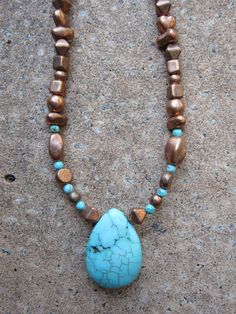 "Copper finish Czech glass Picasso beads paired with tiny turquoise beads and a lovely small turquoise teardrop. Lobster claw clasp. 19\" in length. Handmade." Turquoise Teardrop Faceted Beads Jewelry, Blue Turquoise Teardrop Necklace With Gemstone Beads, Gift Beaded Teardrop Turquoise Necklace, Gift Turquoise Beaded Teardrop Necklace, Gift Teardrop Beaded Turquoise Necklace, Gift Turquoise Teardrop Beaded Necklace, Bohemian Beaded Teardrop Turquoise Necklace, Turquoise Teardrop Necklace With Faceted Beads, Turquoise Teardrop Gemstone Beaded Necklaces