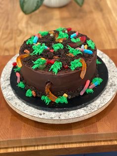 a chocolate cake sitting on top of a wooden table