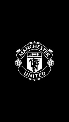 the manchester united logo on a black background