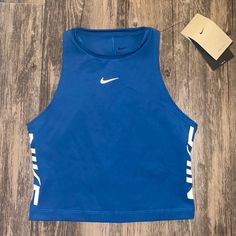 Sporty Nike Dri Fit Crop Top Sz: S Color: Blue Nike Dri-Fit Technology Moves Sweat Away From Your Skin For Quicker Evaporation, Helping You Stay Dry And Comfortable. Wide Armholes Allow You To Move Through Your Full Range Of Motion. Brand New With Tags Nike Blue Athleisure Tops, Nike Blue Sleeveless Tank Top, Blue Nike Workout Top, Nike Blue Workout Top, Blue Nike Top For Workout, Blue Stretch Nike Tops, Fitted Blue Nike Tops, Nike Shirts Women's, Nike Azul