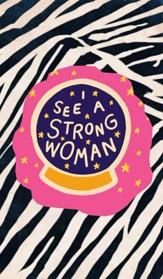 there is a sticker that says see a strong woman on the zebra print background