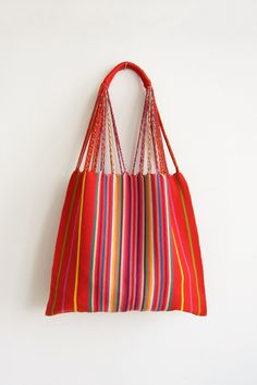 These versatile totes are handwoven by artisans in Chiapas, Mexico on a backstrap loom. Perfect for a beach day, the farmer's market, or as an everyday purse! This bag is approx. 16" wide x 26" tall with the strap. Due to the handmade nature, height and width of bag can vary up to 10%. Hammock Bag, Backstrap Loom, Everyday Purse, Handcrafted Bags, Farmer's Market, Woven Bag, Tote Purse, Black Tote Bag, Beach Day